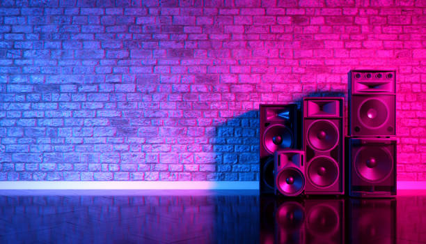 Speakers on the background of an old brick wall in the enon light Speakers on the background of an old brick wall in the enon light, 3d illustration rock n roll music speakers stock pictures, royalty-free photos & images