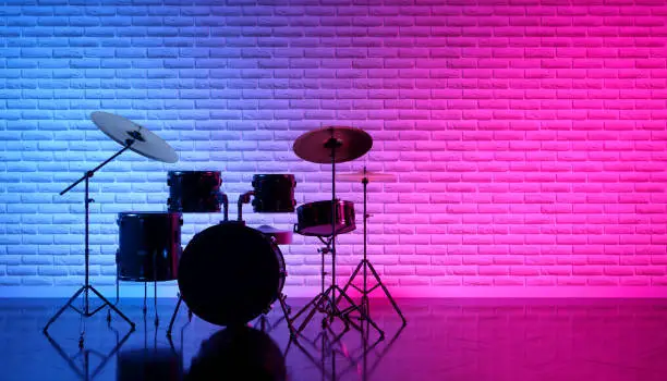 Photo of drum set in beautiful neon light
