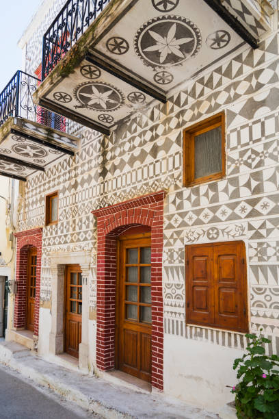 istock Traditional houses decorated with the famous geometric scratch patterns in the medieval mastic village of Pyrgi on the island of Chios, Greece 1161912644