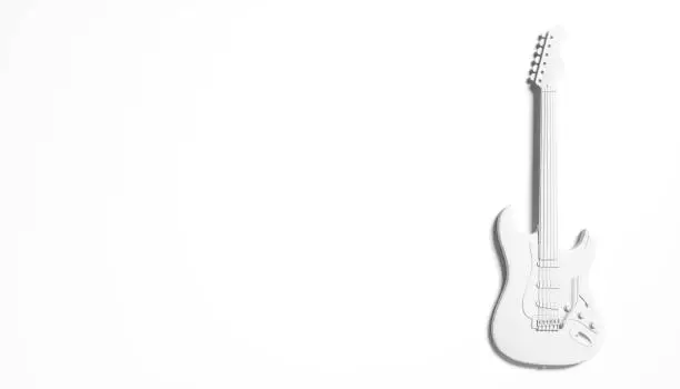 Photo of white silhouette of a guitar on a white background abstraction