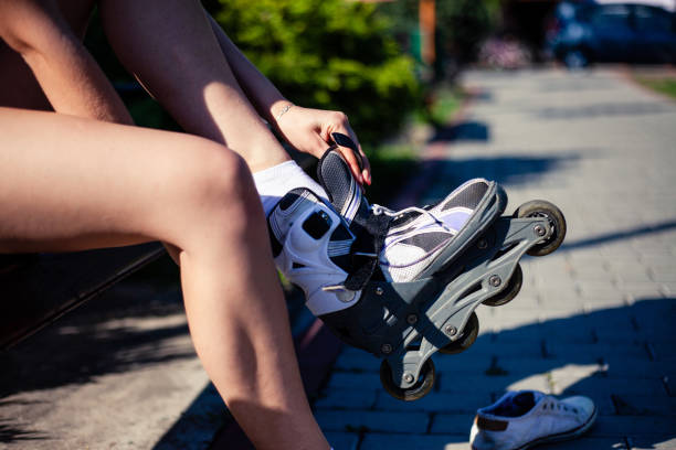 istock Woman putting on inline skates 1161912957