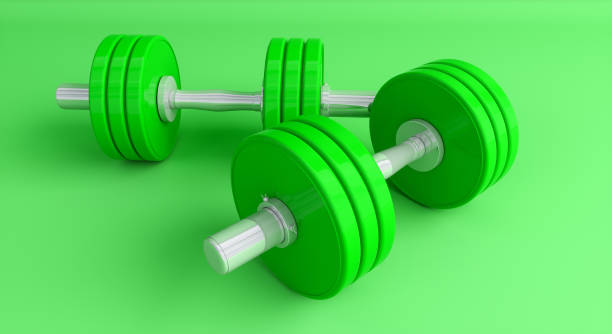 istock green dumbbells on a green background close-up 1161913575