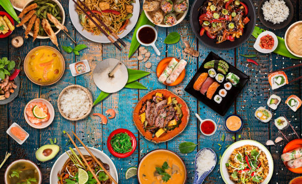 istock Asian food background with various ingredients on rustic wooden table. 1161913707