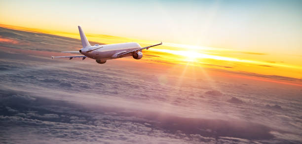 istock Commercial airplane jetliner flying above dramatic clouds. 1161913948