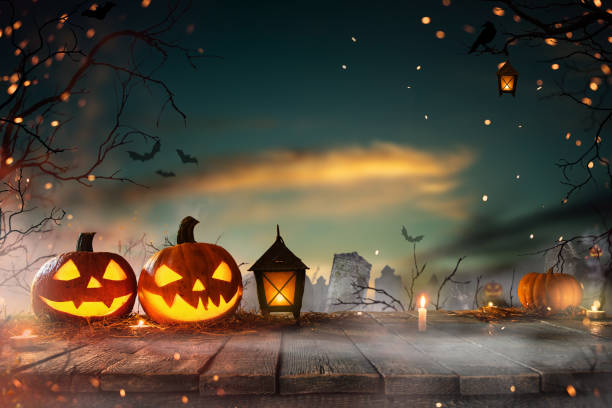 istock Halloween pumpkins on dark spooky forest. 1161914210