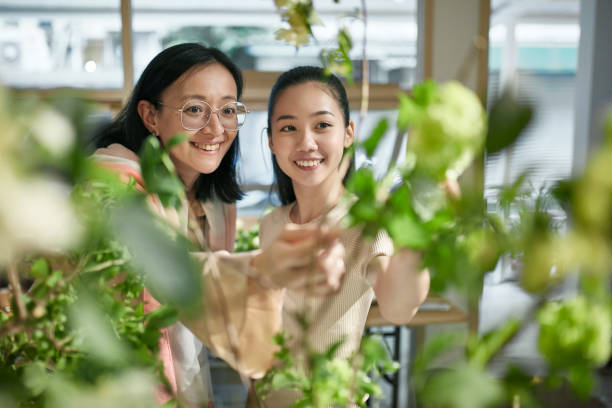 istock Professional Florist and Assistant Admiring an Arrangement 1161915570