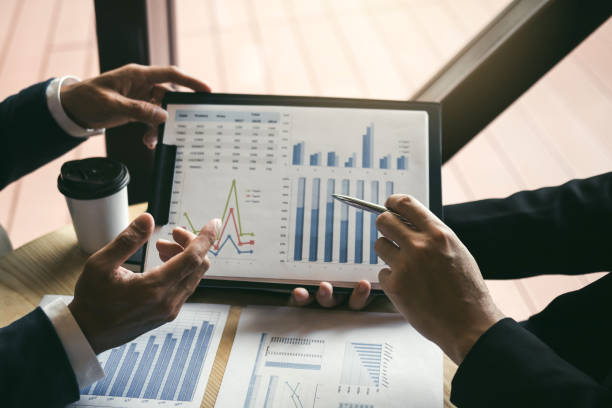istock Colleagues are talking about the results in the documents on hand and compared with the financial information on the laptop screen. 1161915594