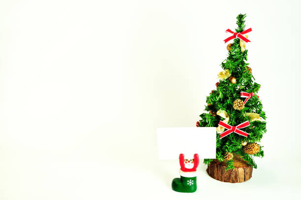 istock Christmas Tree and Santa with a White Paper 1161915755