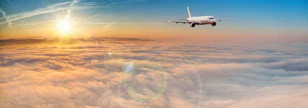 istock Commercial airplane jetliner flying above dramatic clouds. 1161916263