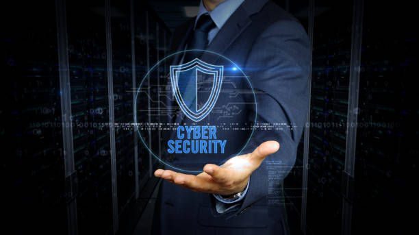 istock Businessman and screen with cyber shield hologram 1161918992