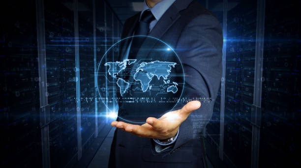 istock Businessman and screen with world hologram 1161919238