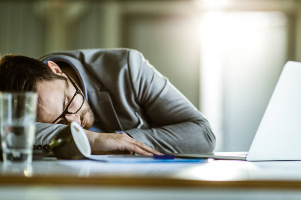istock Exhausted male entrepreneur taking a nap in the office. 1161924367