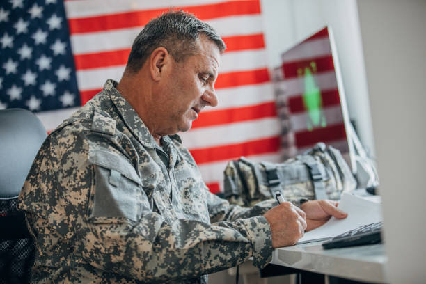 istock Senior soldier doing paperwork at the office 1161924608
