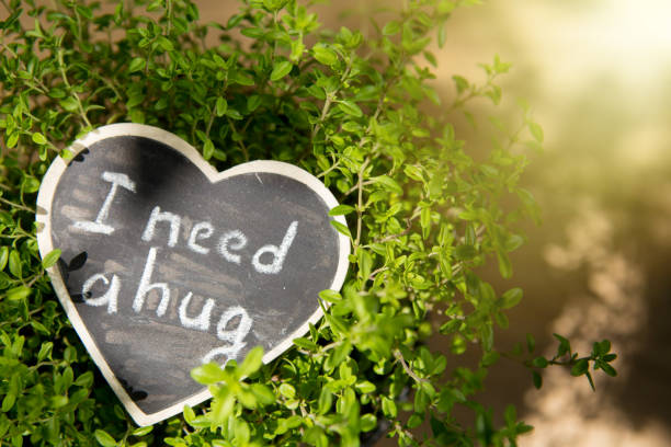 istock I need a hug hand drawing phrase on a heart, Sharing a Hug concept 1161926633