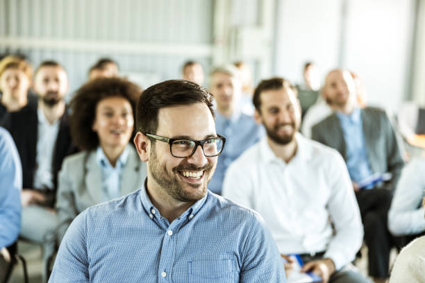 istock Happy businessman attending a training class in board room. 1161926756