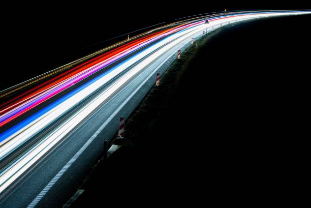 istock lights of cars with night 1161928764