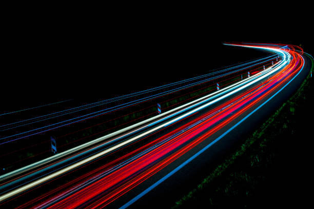 istock lights of cars with night 1161928775