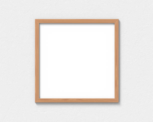 istock Square wooden frames mockup hanging on the wall. Empty base for picture or text. 3D rendering. 1161929255