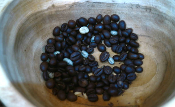 Coffee bean Coffee bean on wooden bowl. biji kopi stock pictures, royalty-free photos & images