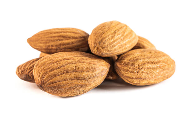 istock almond seeds isolated on white background 1161930392