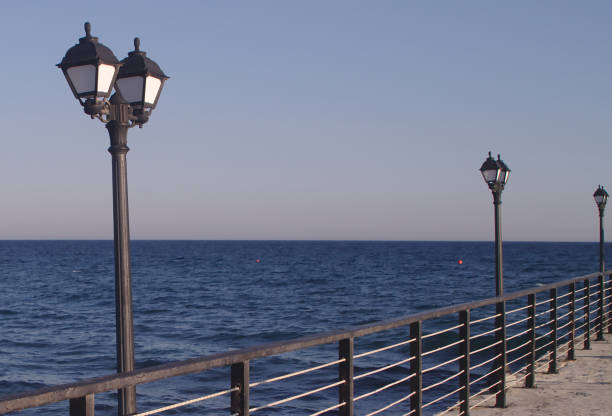 istock Street lights on sea pier 1161938244