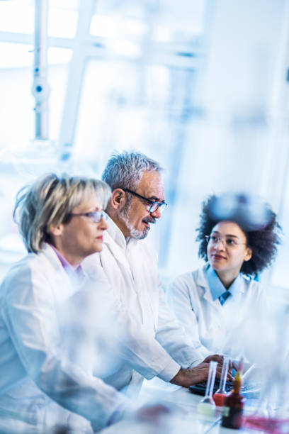 istock Team of biotechnologists working on a research in a laboratory. 1161938302