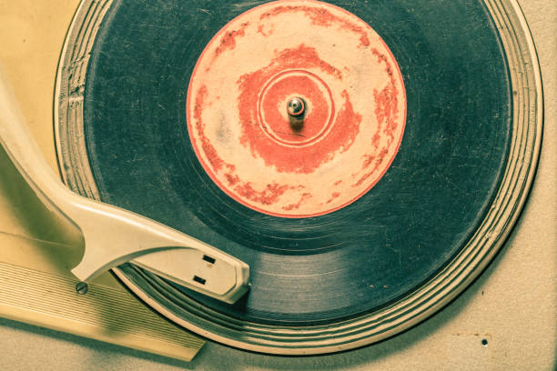istock Old record player with few black vinyl records 1161939785