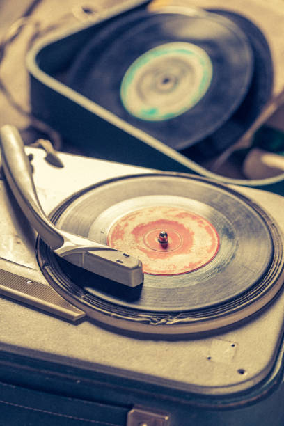 istock Retro gramophone with few black vinyl records 1161940465
