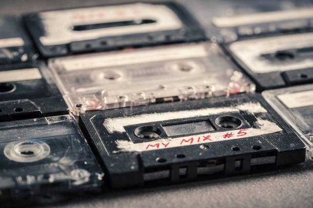 istock Closeup of audio cassettes on grey table 1161941169