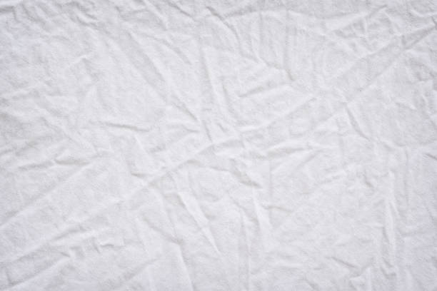 istock White fabric texture wrinkled texture ,Soft focus clean white fabric crumpled use us background or backdrop design 1161941356