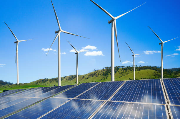 istock Solar panel and wind turbine farm clean energy. 1161944466