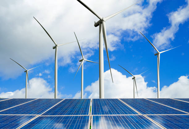 istock Solar panel and wind turbine farm clean energy. 1161944511