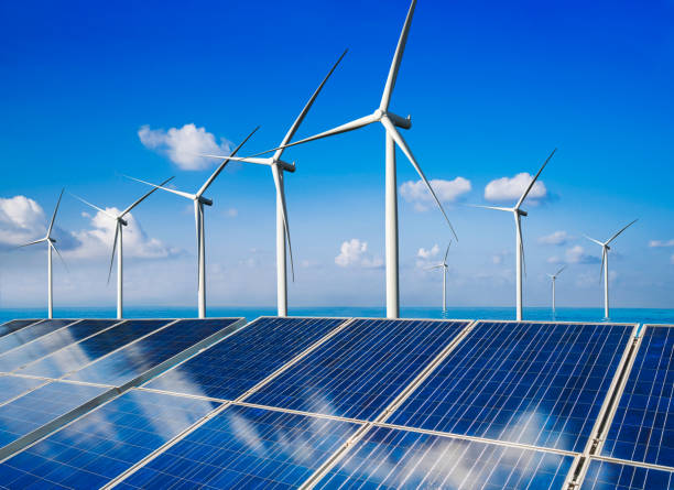 istock Solar panel and wind turbine farm clean energy. 1161944520