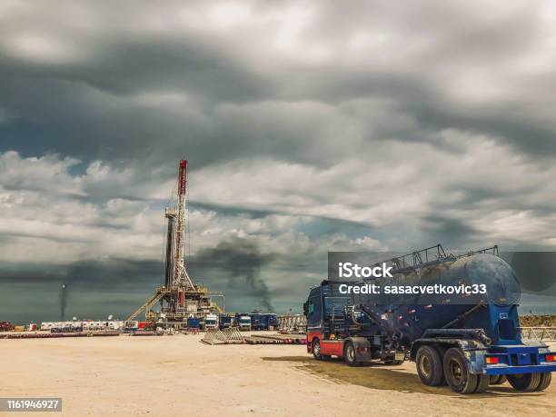 Fracking Oil Rig At Sunset Stock Photo - Download Image Now - Fracking, Crude Oil, Natural Gas