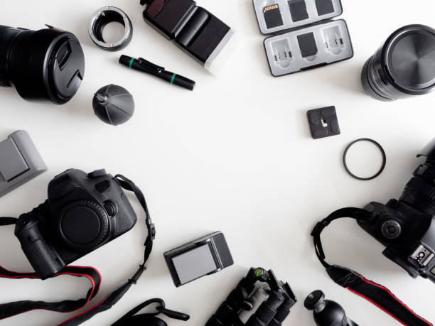istock top view of work space photographer with digital camera, flash, cleaning kit, memory card, tripod and camera accessory on white table background 1161947097