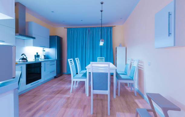 istock Interior. Kitchen modern, light yellow walls, blue curtains 1161949234
