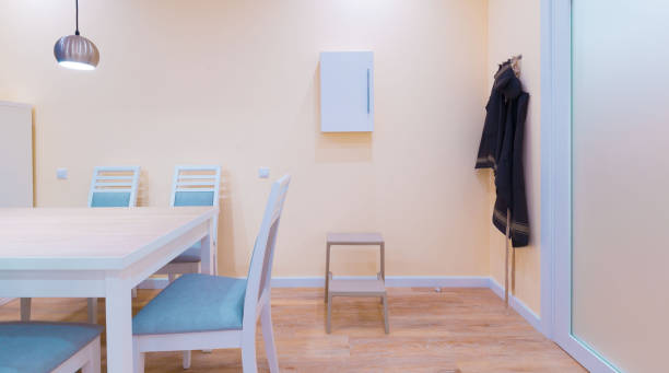 istock Interior. Kitchen modern, light yellow walls, white furniture 1161949485