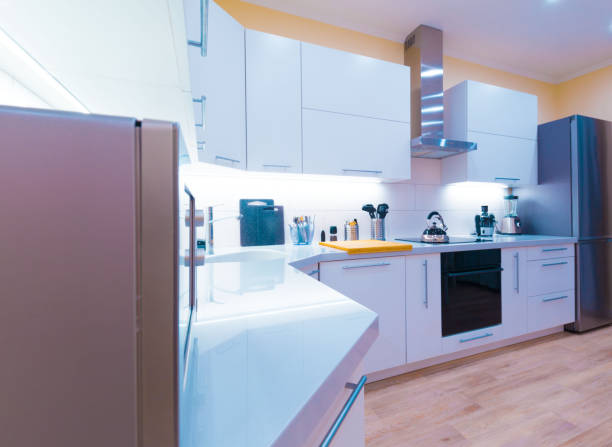 istock Interior. Kitchen modern, light yellow walls, white furniture 1161949497