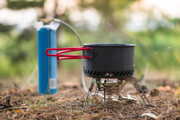 istock Foldable camping gas fire system  with gas baloon and  a pot with radiator for fast heating 1161949648