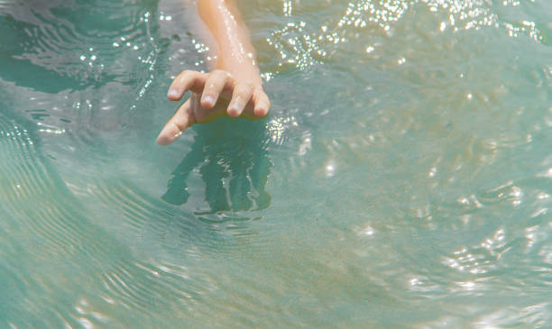 istock The baby is drowning in water. Selective focus. 1161949693