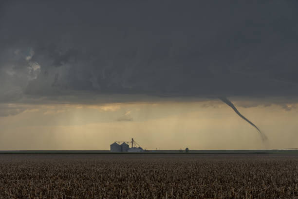 St Francis, Kansas, USA - June 29th, 2019: Tornado next to a silo stock photo