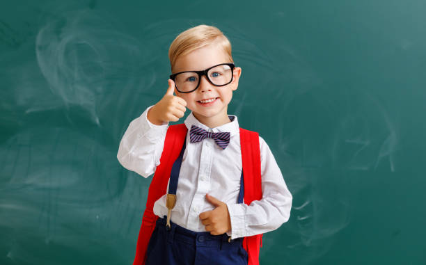 istock the child   schoolboy  boy student about school blackboard 1161952037