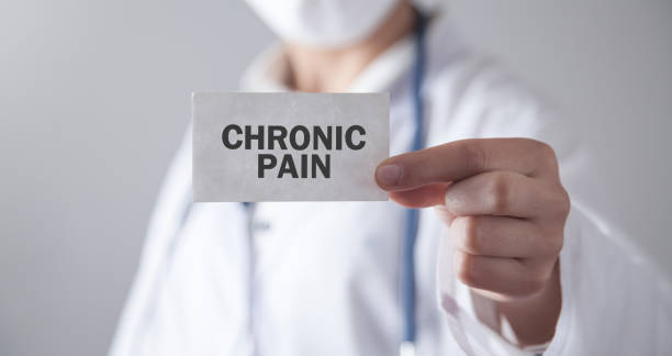 Doctor holding card. Chronic Pain stock photo