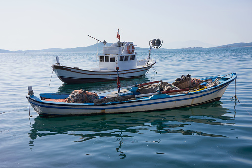 Blue fishing boats at sea