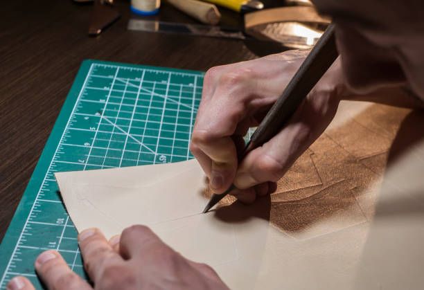 istock craftsman cuts the skin 1161955474