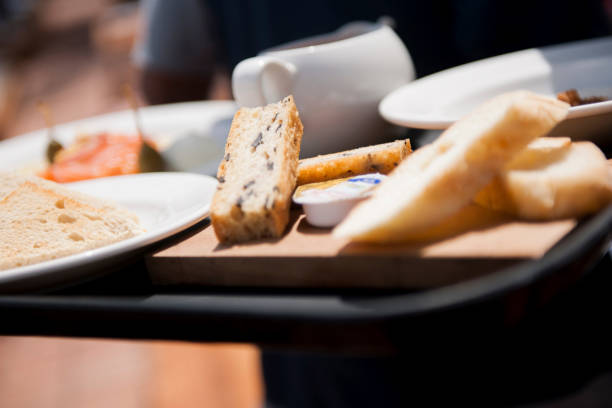 istock Waiter serving salmon appetizer, sandwiches and soup 1161957162