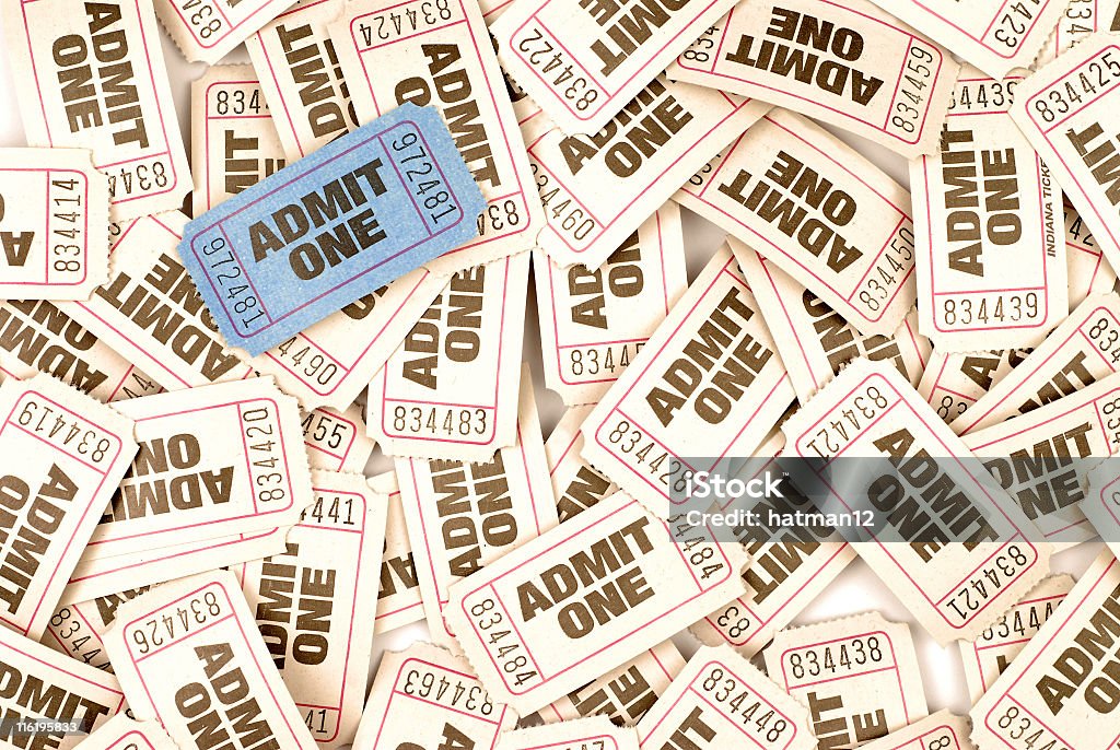 Bundle of admit one admission tickets Numerous cream admission tickets background with one unique ticket in blue.  Alternative version shown below: Box Office Stock Photo