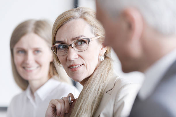 istock Business people sitting in a row 1161958666
