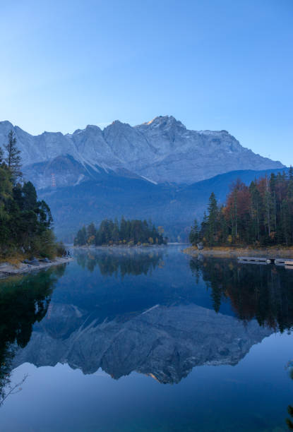 istock Reflections of the sunrise at the Eibsee 1161958799