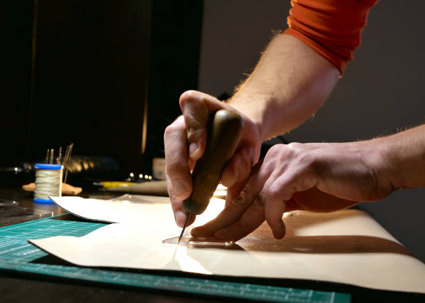 istock craftsman cuts the skin 1161959387